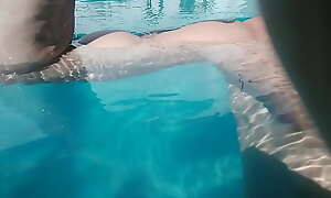 Bicep flexing in the pool